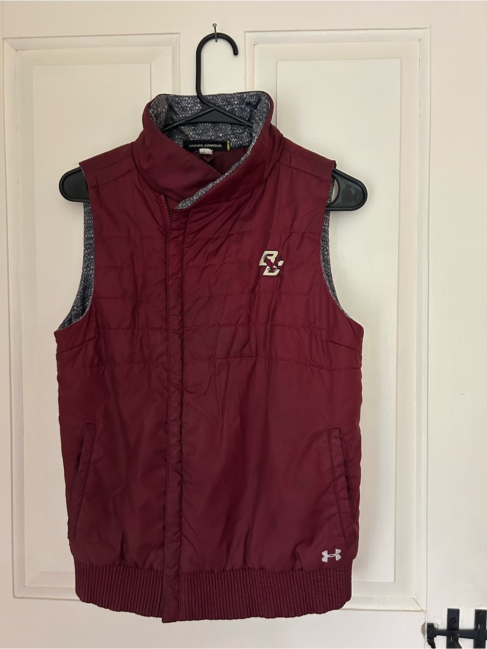 Under Armour woman’s Maroon Puffer Vest with Boston College Logo